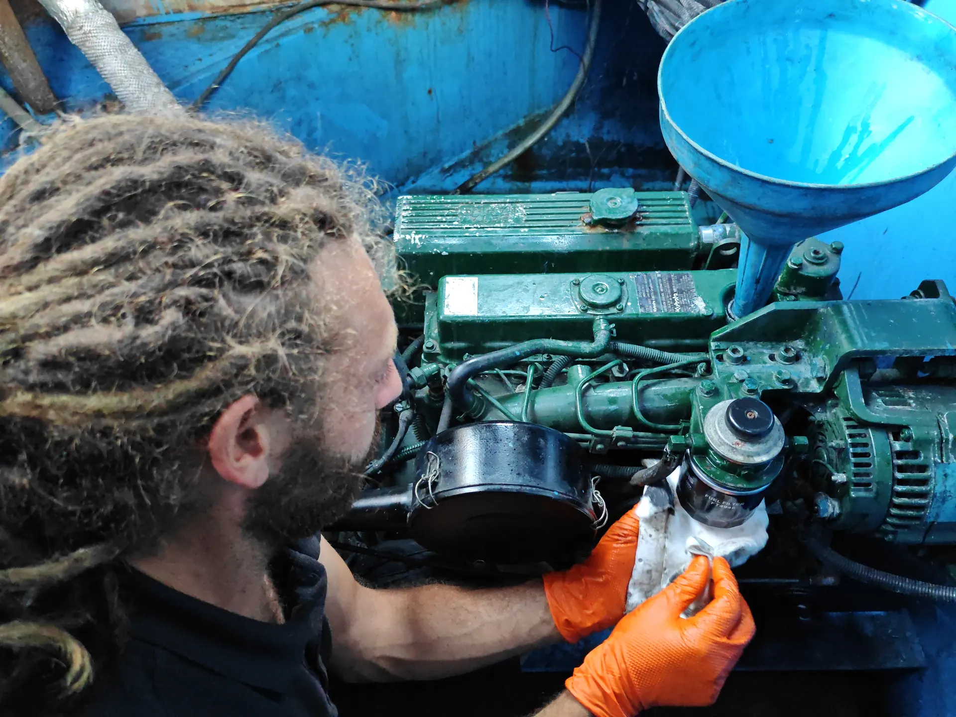 Oli from Milners Marine servicing a marine diesel engine on a Thames boat