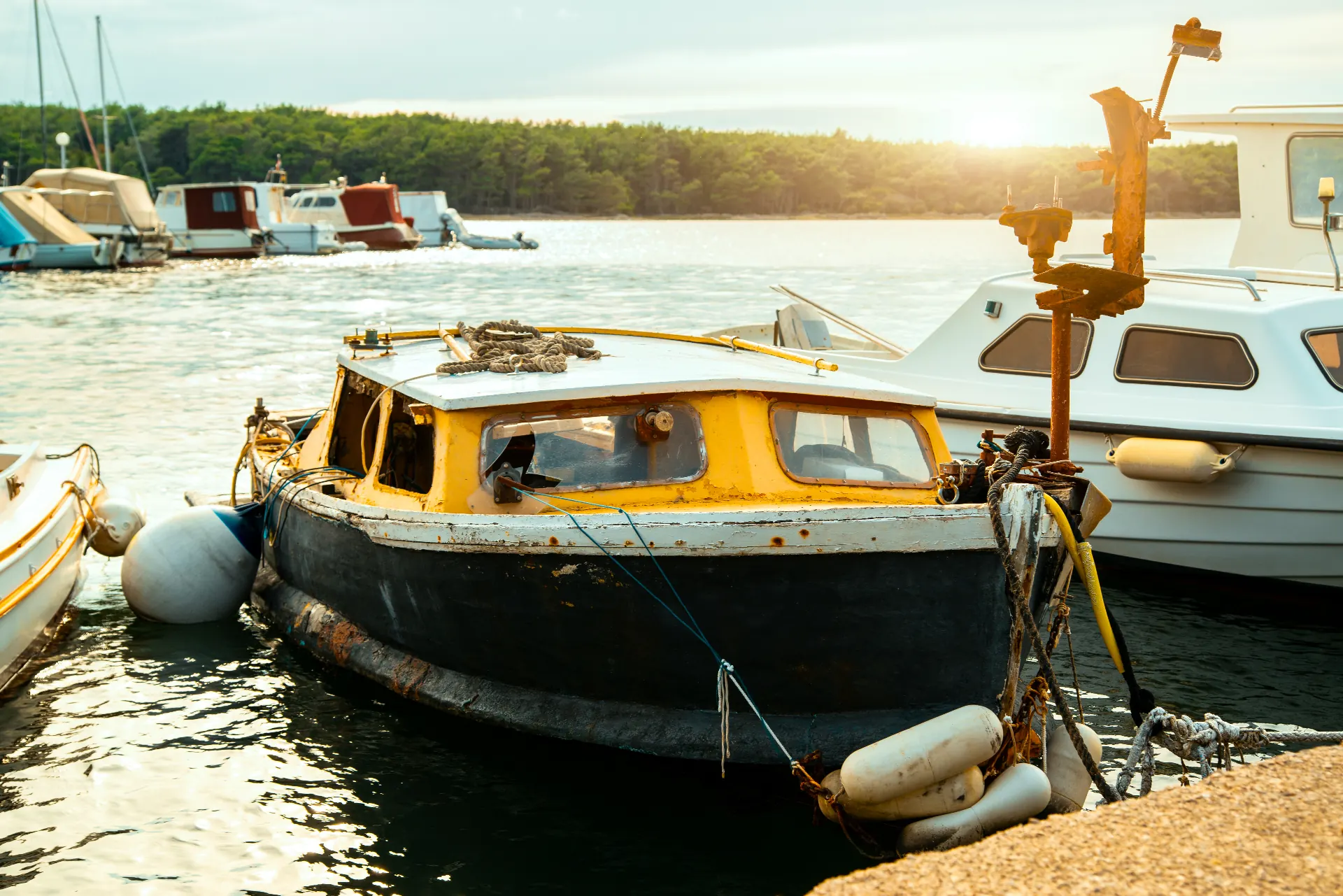 Moored boat in golden morning light, ready for spring recommissioning.